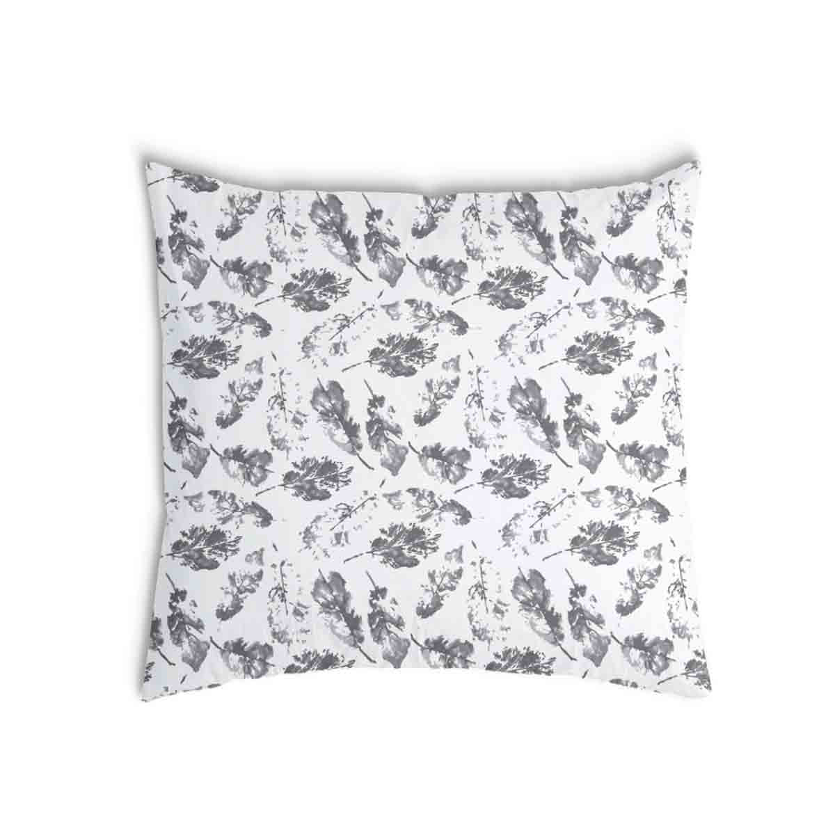 Almohada de salud blanca con hojas grises