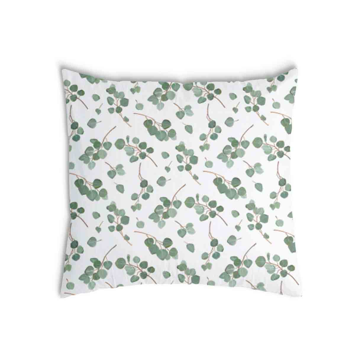 Almohada de salud blanca con ramas de eucalipto