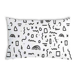 White health pillow with black shapes.