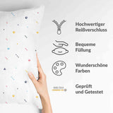 White health pillow with colorful shapes