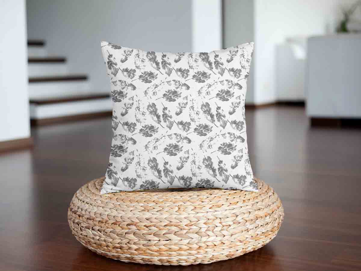 Almohada de salud blanca con hojas grises