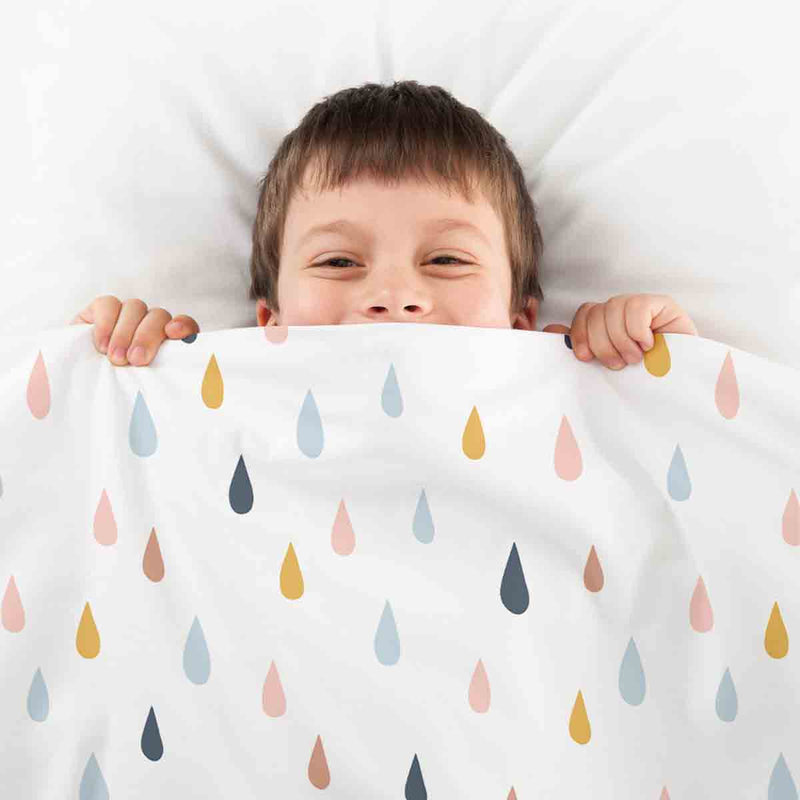 Therapy blanket and bedding set with colorful drops.
