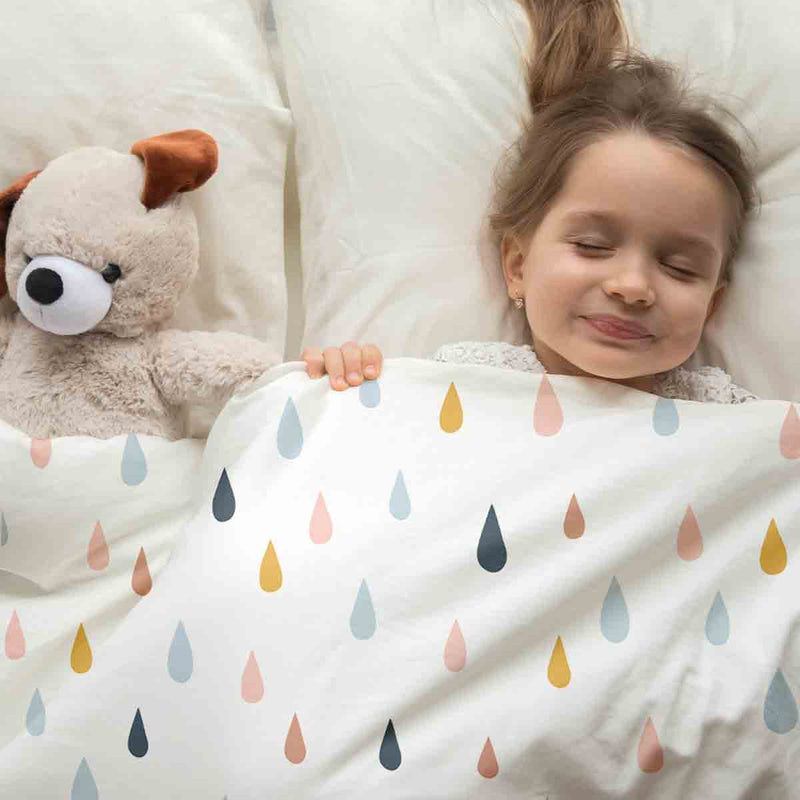 Therapy blanket and bedding set with colorful drops.