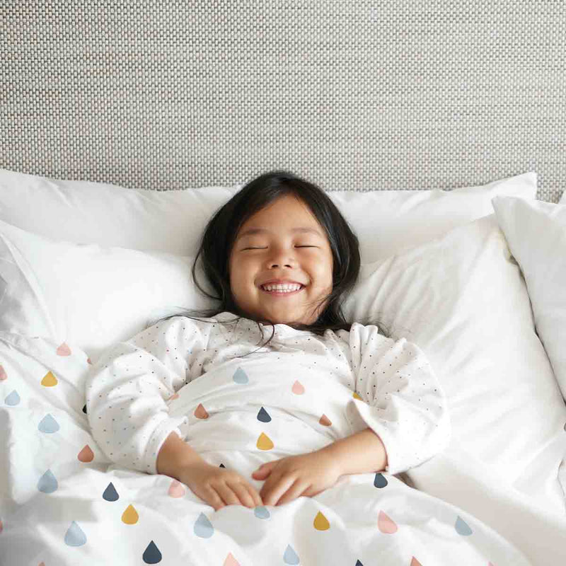 Therapy blanket and bedding set with colorful drops.