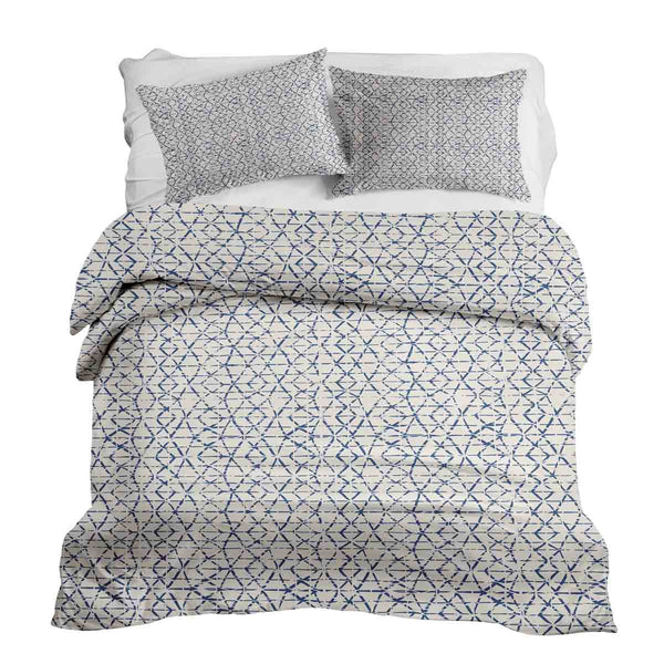 Therapy blanket and bedding set, white with delicate blue shapes.