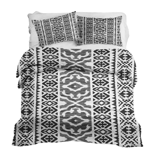 Set de ropa de cama con mantas terapéuticas y formas negras