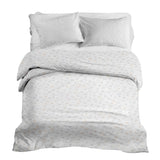 Therapy blankets and bedding set with delicate bouquets of flowers.