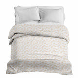 Therapy blanket and bedding set with orange circles.