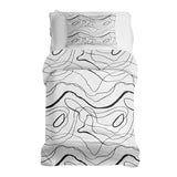 Set de ropa de cama con mantas terapéuticas y líneas serpenteantes negras