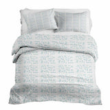 Therapy blanket and bedding set, white with blue shapes.