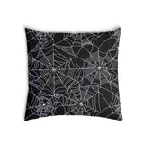 Health pillow, black with spiderweb pattern.