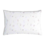 Almohada de salud blanca con ramas rosas