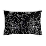 Health pillow, black with spiderweb pattern.