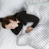 Therapy blanket bedding set, white with delicate checks.