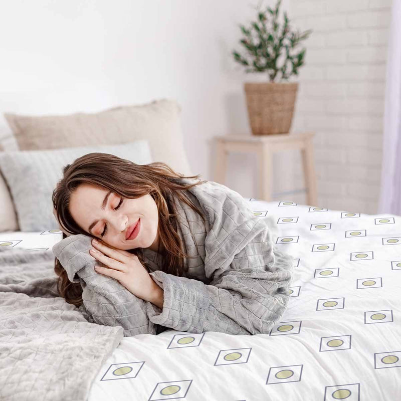Therapy blanket and bedding set, white with green circles.