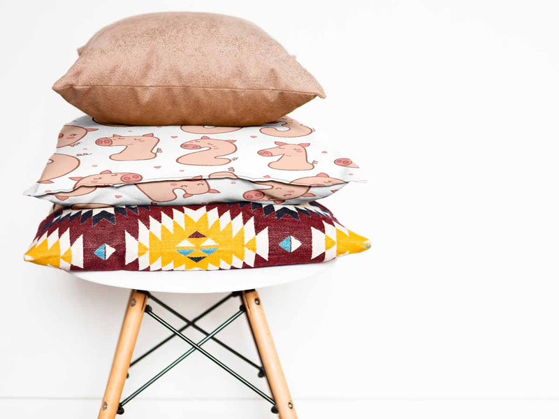 White health pillow with numbers and pigs