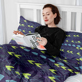 Therapy blanket and bedding set, dark blue with arrows.