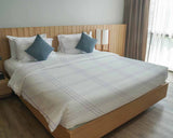 Therapy blanket bedding set, white with purple stripes.
