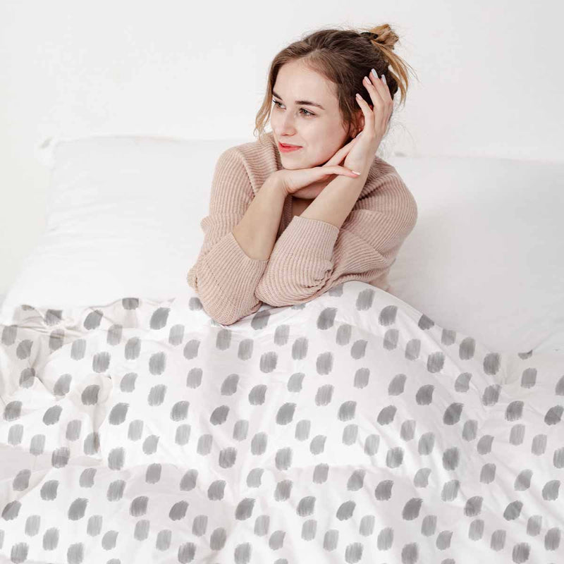 Therapy blanket and bedding set, white with grey dots.