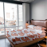 Therapy blanket and bedding set, white with numbers and pigs.