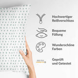 Health pillow, white with green crosses.