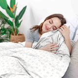 Therapy blankets and bedding set with delicate bouquets of flowers.
