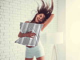 Health pillow, grey with thick and thin stripes.