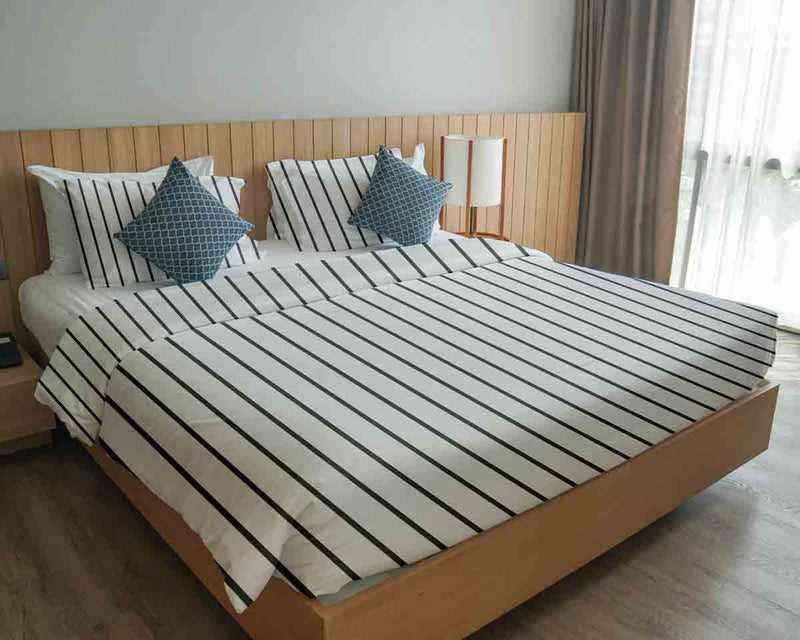 Therapy blanket bedding set, white with black stripes.