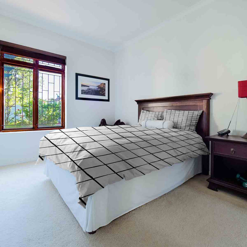 Therapy blanket and bedding set, white with black checks.