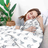 Therapy blanket bedding set, white, with boho earrings.