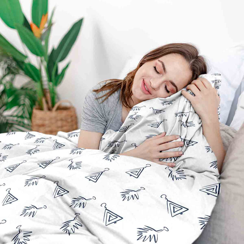 Therapy blanket bedding set, white, with boho earrings.
