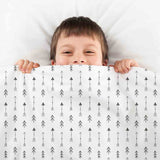 Therapy blanket and bedding set, white with many black arrows.