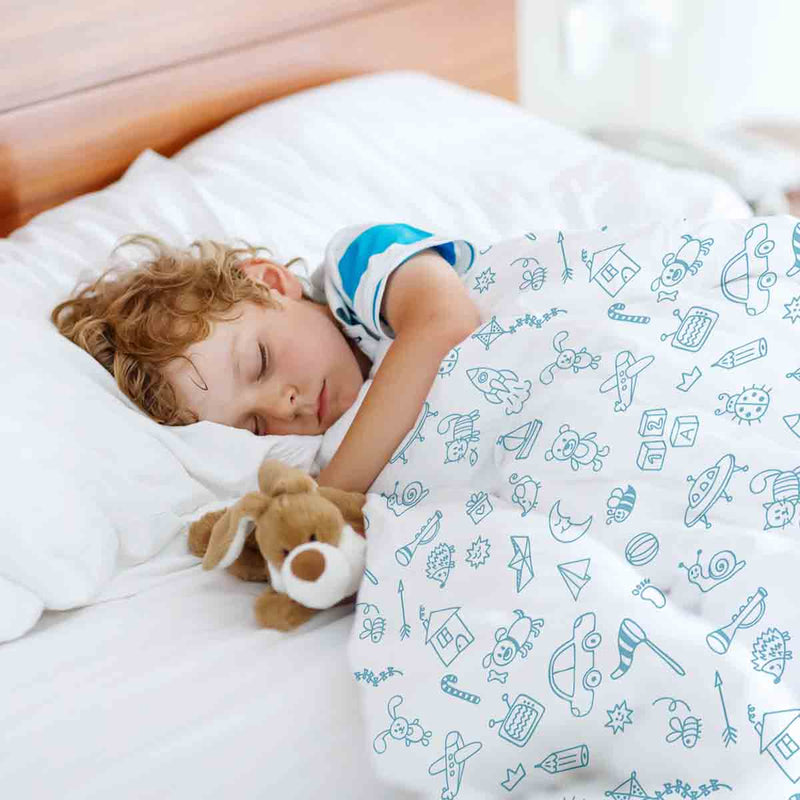 Therapy blanket and bedding set, white, with toys.