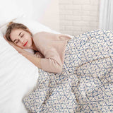 Therapy blanket and bedding set, white with delicate blue shapes.