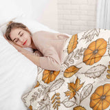 Therapy blanket bedding set, white with leaf and pumpkin pattern.