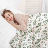 Therapy blanket bedding set, white with eucalyptus branches.