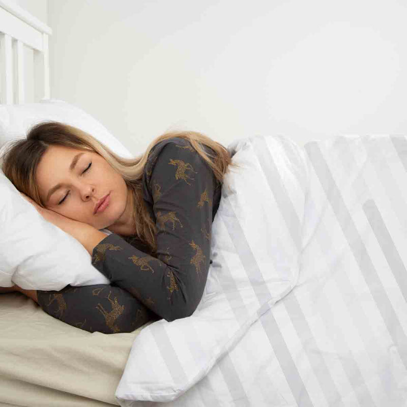 Therapy blanket bedding set, white with delicate stripes.