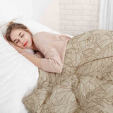 Therapy blanket bedding set, beige with black leaf pattern.