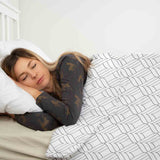 Therapy blanket bedding set, white with 3D shapes.