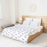 Therapy blanket bedding set, white, with boho earrings.