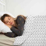 Therapy blanket and bedding set, white with many grey dots.