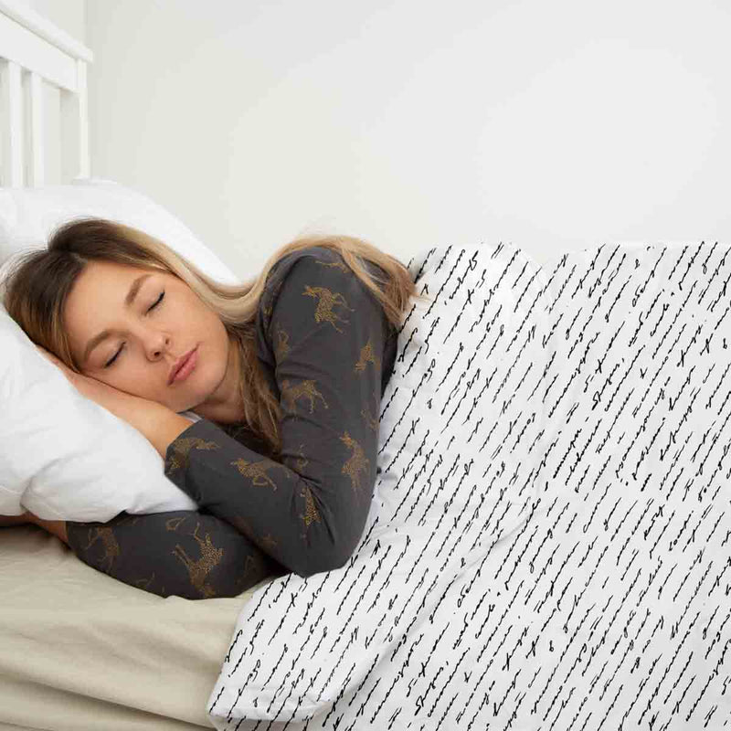 Therapy blanket and bedding set, white with lettering.