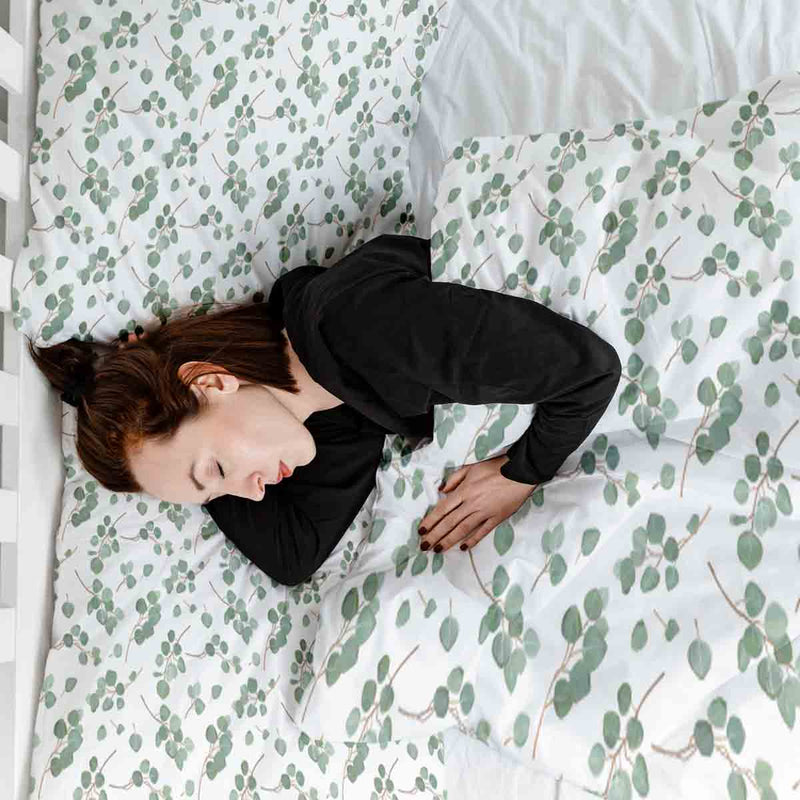 Therapy blanket bedding set, white with eucalyptus branches.