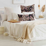Health pillow, black with purple leaves.