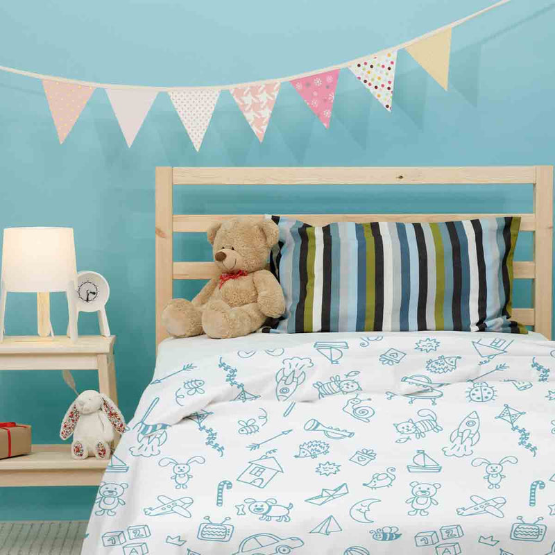 Therapy blanket and bedding set, white, with toys.