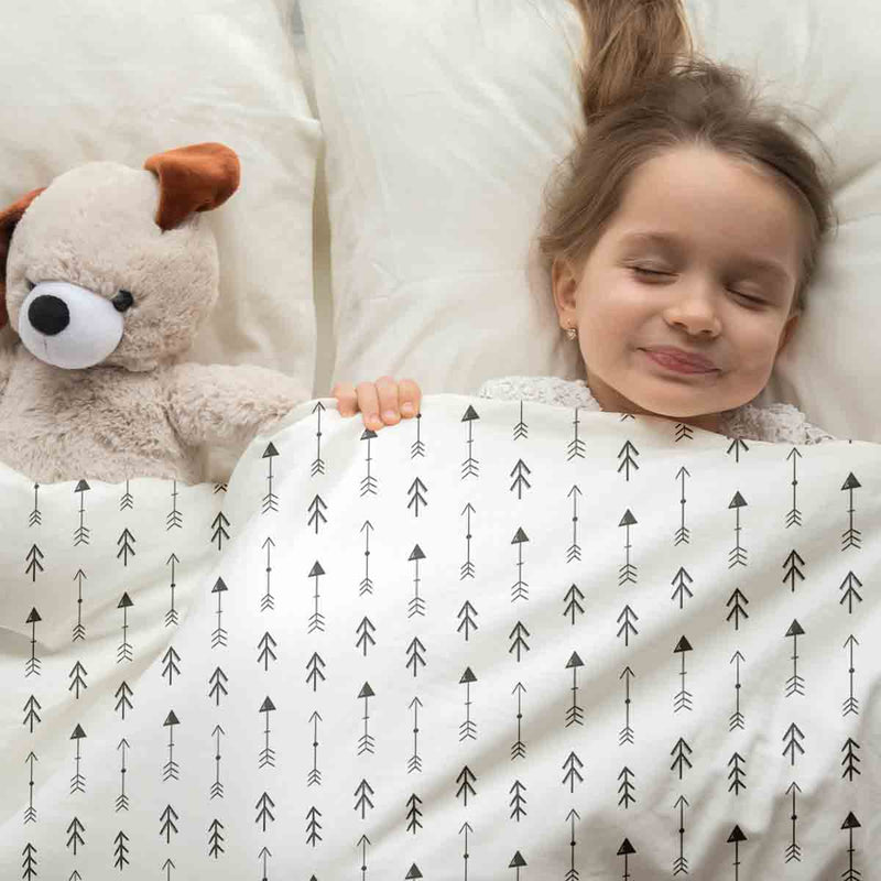 Therapy blanket and bedding set, white with many black arrows.