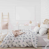 Therapy blanket bedding set, white, with boho earrings.