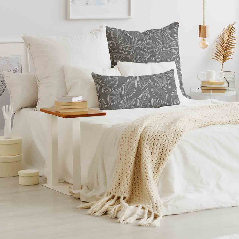 Health pillow, grey with white palm leaves.