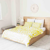 Set di biancheria da letto con coperte terapeutiche e rami gialli