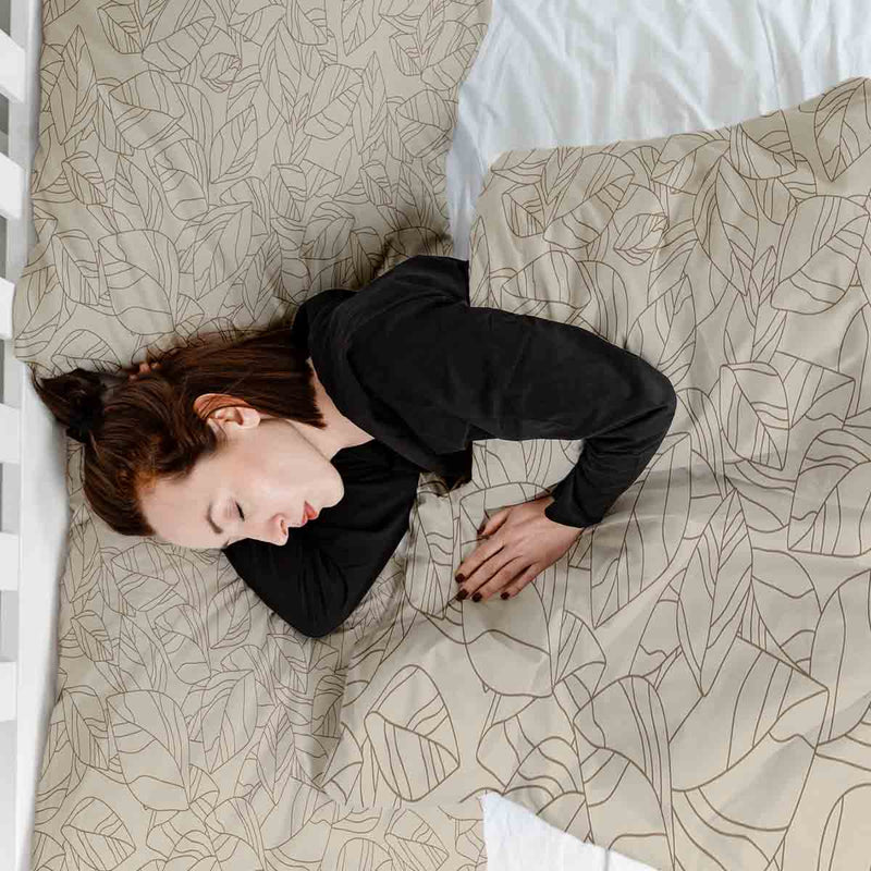 Therapy blanket bedding set, beige with black leaf pattern.